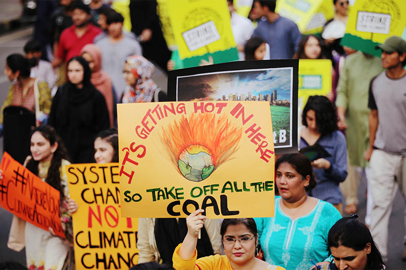 People take part in the Global Climate Strike walk in Lahore,